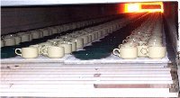 Product going into kiln where it is gradually heated to 2400 degrees Fahrenheit.